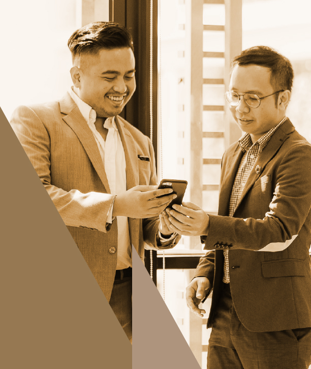 Two men looking at a mobile.
