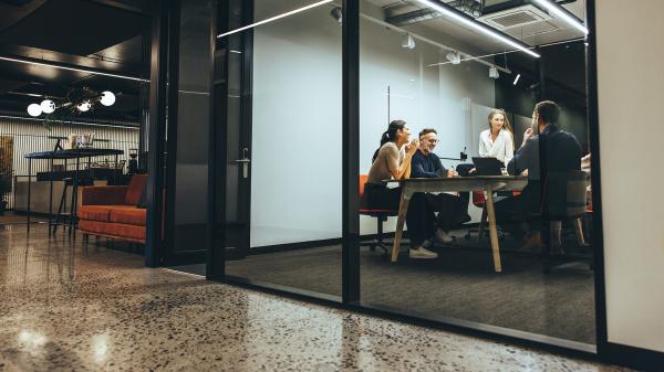 Team meeting in modern glass office