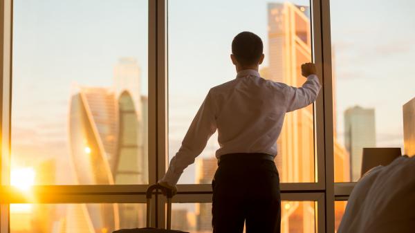 Business man looking out office window