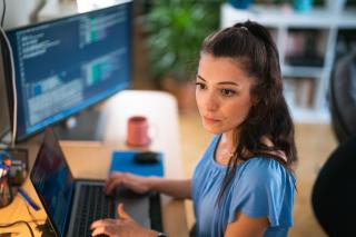 Woman working at desktop computer