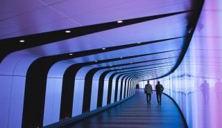 A high-tech digital corridor representing the enterprise technology ecosystems of global industry leaders who partner with Deerfoot to source niche Product Specialists and Subject Matter Experts.