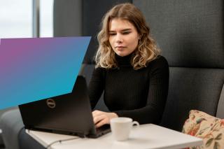 Female IT professional working on her laptop.