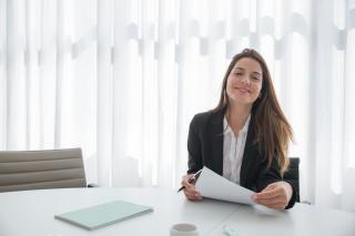 Professional female looking happy at work.