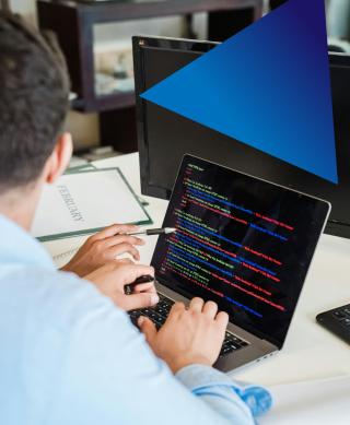 IT professionals working on a laptop.