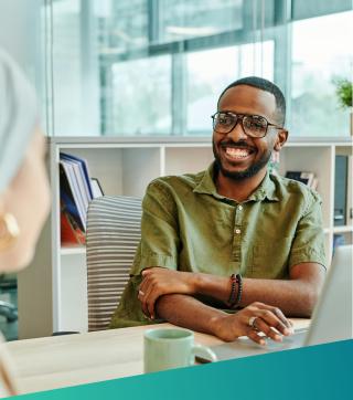 Smiling employee talking to a colleague