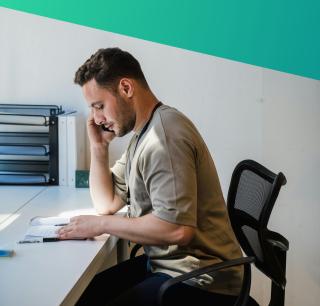 A focused IT recruitment consultant at Deerfoot conducting candidate research and architectural mapping, illustrating our hands-on commitment to technical vetting and precision hiring.
