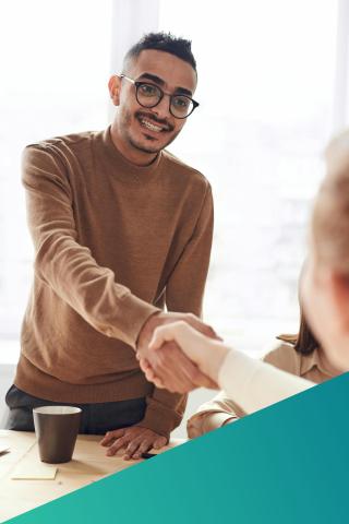 Employee shaking hands with client