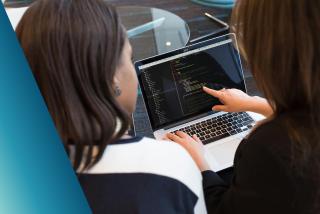 Two team members reviewing code