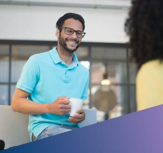 Team members having a chat over coffee