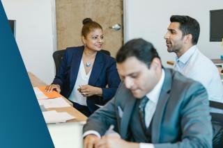 Senior Deerfoot consultants and stakeholders reviewing 2026 IT Business Analysis salary benchmarks and market data to ensure competitive and evidence-based hiring strategies