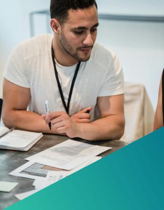 Man reviewing paperwork in office