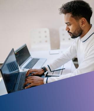 Alt Text: A Data Analytics specialist performing deep-dive data exploration and financial modelling on high-performance laptops.