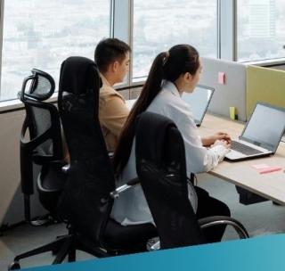 A professional team of IT consultants working in a high-rise London office, showcasing Deerfoot's modern, collaborative approach to technology recruitment.