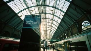 London King's Cross station platform sign beneath the glass train shed roof
