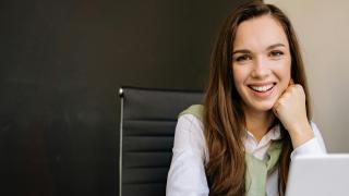Female professional looking straight to camera.
